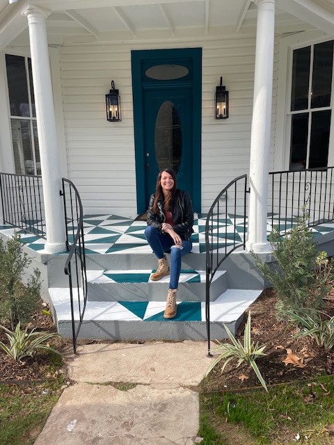Jenny Cureton sitting in a Fredericksburg remodel during winter in the Texas Hill Country